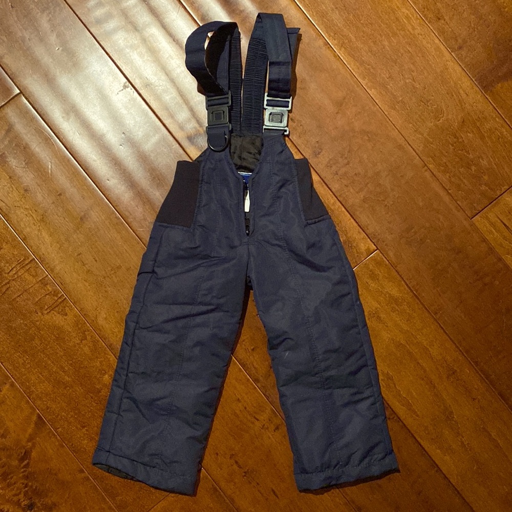 Infant navy blue snow bib.